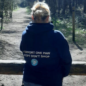 Back of a hoodie showing One Paw logo and branding